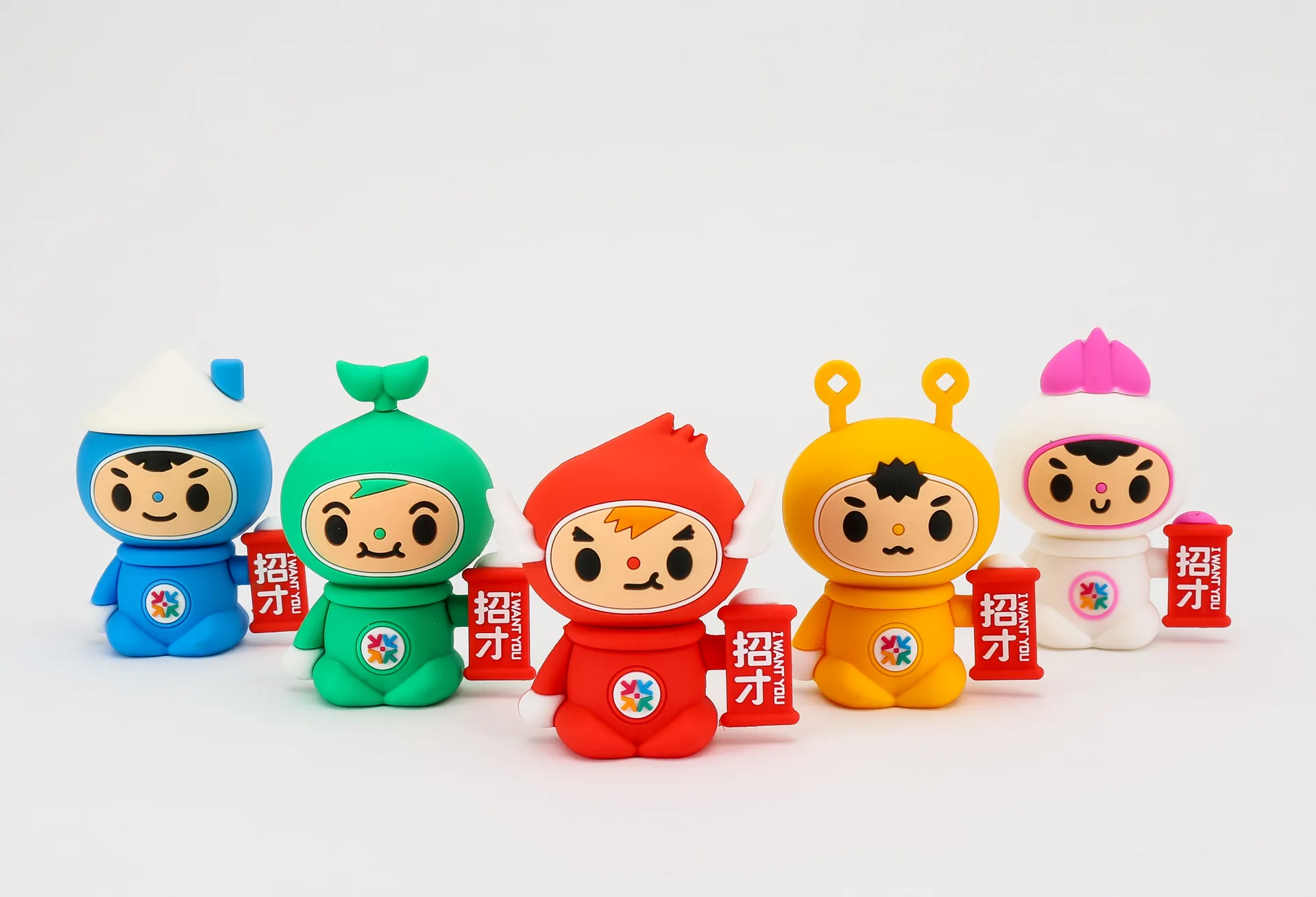 Row of painted PVC figures after assembly
